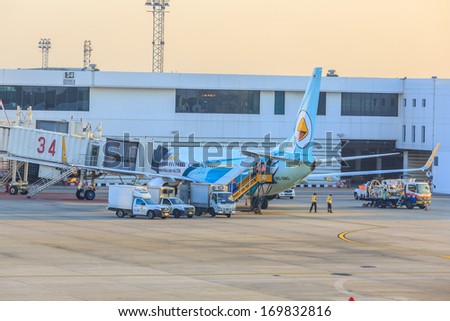 BANGKOK - DECEMBER 18: Nok Air flights for servicing at Don Mueang International Airport on Dec 18, 13 in Bangkok. It is considered to be one of the worlds oldest international airports.