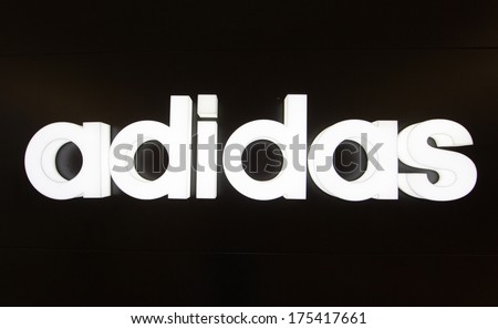 Kuala Lumpur - December 23: Adidas Logo At Klcc On Dec 23, 2013 In Kl, Malaysia. It Is A German Multinational Corporation That Designs And Manufactures Sports Clothing And Accessories.