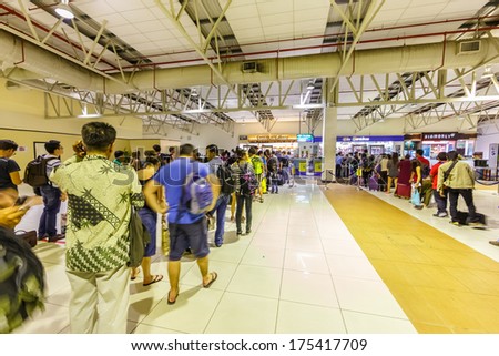 KUALA LUMPUR - DECEMBER 23: Passengers in Low cost carrier terminal (LCCT) on Dec 23, 2013 in Kuala Lumpur, Malaysia. It was opened to cater for the growing number of users of low cost airlines.