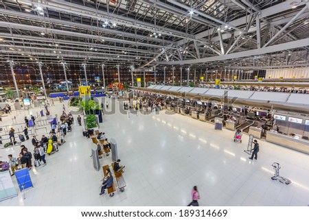 BANGKOK- FEB 10. Passengers checking in at the counter at Suvanaphumi Airport, Bangkok on Feb 10, 2014. Suvarnabhumi airport is world\'s 4th largest single-building airport terminal.