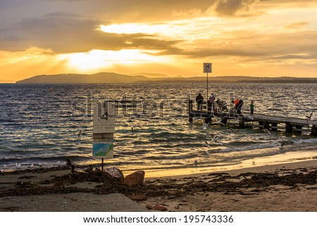 NELSON BAY, AUSTRALIA - MAY 8 : People do fishing at Nelson Bay, Australia on May 8, 14. Nelson Bay is a suburb of the Port Stephens local government area in the Hunter Region of NSW, Australia.