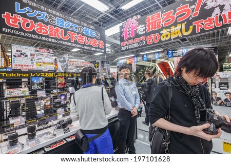 TOKYO -APRIL 11: People shop for camera at Yodobashi electronic store on April 11, 14 in Akihabara. It is a chain store mainly selling electronic products. Currently, there are 21 stores in Japan.