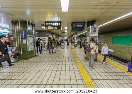 OSAKA - APR 5: Passengers in Umeda Station on Apr 5, 14 in Osaka. It is a railway station located in Kita-ku in the northern commercial center of Osaka, It is the busiest station in Western Japan.