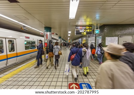 OSAKA -APRIL 6: Passengers at Namba Subway station on April 6, 14 in Osaka. Osaka Municipal Subway is the metro network, forming an integral part of the extensive mass transit system of Greater Osaka.