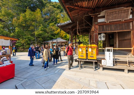 KYOTO, JAPAN - APR 8: Tourists visit Kinkaku-ji temple on Apr 8, 14 in Kyoto. It is a Zen Buddhist temple in Kyoto, Japan, the garden complex is an excellent example of Muromachi period garden design.