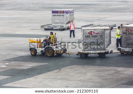 MANILA - FEBRUARY 15: Airport workers at Ninoi International Airport on Feb 15, 14 in Manila, Philippines. It is the airport serving Manila and its surrounding metropolitan area.