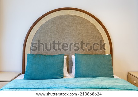green pillows on the bed
