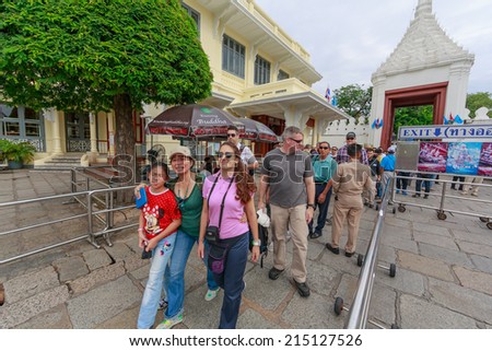 BANGKOK - AUG 2: Tourists visit Temple of the Emerald Buddha Aug 2, 2014 in Bangkok, Thailand. The temple is regarded as the most sacred Buddhist temple (wat) in Thailand which for Royal Ceremony.
