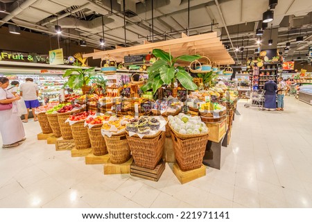 BANGKOK - JUN 22: People shop at Tops Suppermarket on Jun 22, 2014 in Bangkok.It\'s a grocery chain in Thailand, the chain is operated under the name Tops Supermarket by the Central Food Retail.