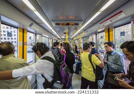 SYDNEY - MAY 16: Passengers in Light Rail on May 16, 2014 in Sydney. Sydney Trains is owned by the Government of New South Wales and operates all passenger rail services in metropolitan Sydney.