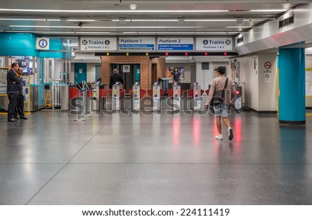 SYDNEY - MAY 16: Passengers in King Cross train station on May 16, 2014 in Sydney. The station is on the Eastern Suburbs line, one of the Sydney underground railways.
