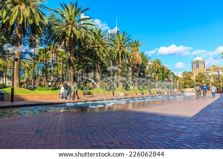 SYDNEY - MAY 12: The fountain at Tumbalong Park on May 12, 2014 in Sydney. It is a park in Darling Harbour, was designed using native Australian foliage incorporated with fountains as an urban stream.