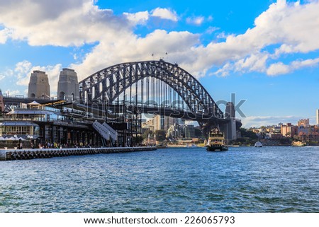 SYDNEY - MAY 11: Sydney Harbor Bridge on May 11, 2014 in Sydney. It is a steel arch bridge across Sydney Harbor that carries rail, vehicle and pedestrian traffic between the city and the North Shore.