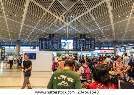 TOKYO - JUL 19: Long line of passengers checking in at Narita Airport on Jul 19, 2014 in Tokyo. It is the primary international airport serving the Greater Tokyo Area of Japan.