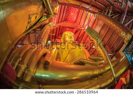AYUTTHAYA, THAILAND - JUN 1: Big Buddha statue at Wat Phanan Choeng temple on Jun 1, 2015 in Ayutthaya. The temple is in the city of Ayutthaya which is a popular tourist attraction.