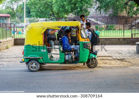 NEW DELHI - AUG 4: Tricycle with the driver on Aug 4, 2015 in New Delhi. India with 17.5% of total world\'s population, had 20.6% share of world\'s poorest in 2011.