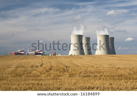 Nuclear power station, Temelin, Czech Republic - cooling towers, containment buildings, gold stubble-field in foreground