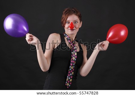 Young girl as mime with red nose