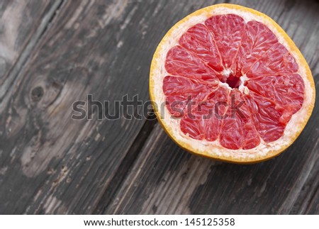 red grapefruit on old table