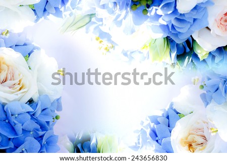 Frame with blue hydrangea flowers and white rose