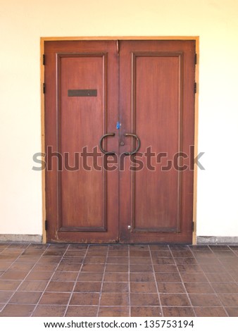 A Vintage wooden door with bronze handle as background