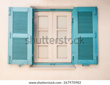 opened colorful wooden window in Santorini in Greece