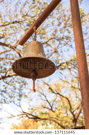 antique old metal bell on the pole