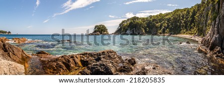 Panorama of the sea landscape in sunny day on the shore of the ocean with a rocks, bay Telyakovsky island languishing heart, Far East, Russia