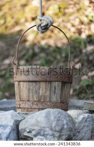 old wooden bucket at the well