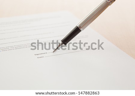 Man hand signing a contract