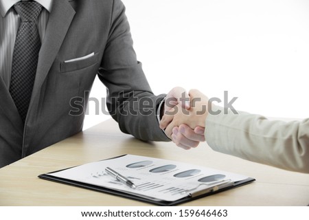 Business handshake and business people with Business Report