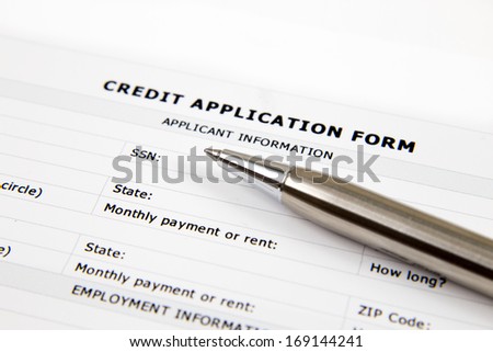 Blank Credit Application Form And Pen on desktop