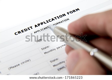 Blank Credit Application Form And Pen on desktop
