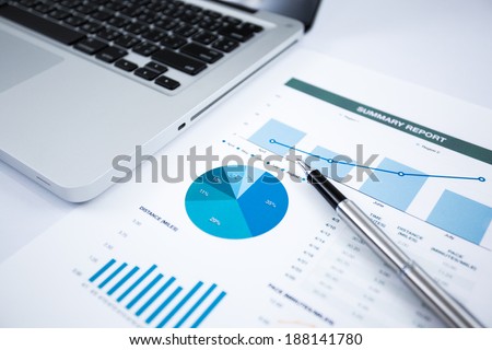 Businessman analyzing investment charts with laptop. Accounting