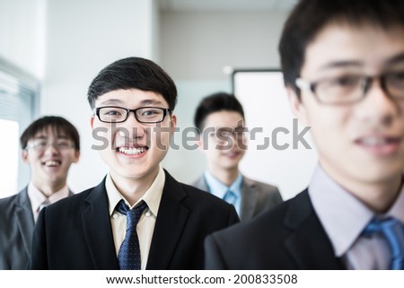 Group of business people with businessman leader on foreground.Asian