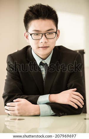 Image of young handsome confident businessman in suit.Asian