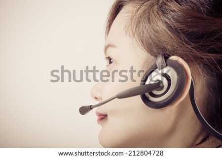 Portrait of happy smiling cheerful support phone operator in headset, isolated on white background