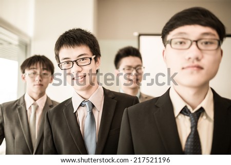 Group of business people with businessman leader on foreground.Asian