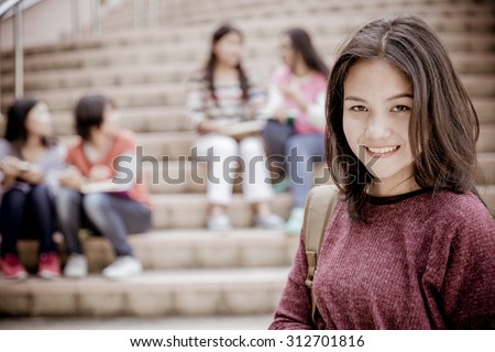 group of happy teen high school students outdoors