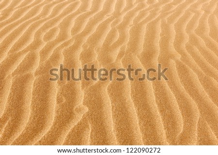 Clean rippled sand on the ocean beach