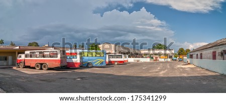 CIENFUEGOS, CUBA -  MAY 5: Panoramic view to Cienfuegos bus station with buses and so called buses standing waiting for departure shown on 5 May 2008 in Cienfuegos, Cuba