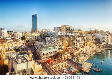 MALTA - JANUARY 20 2015: View to Portomaso tower over Spinola bay shore with famous touristic restaurants at St Julian, Malta