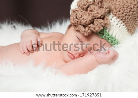 Sleeping baby in knitted cap