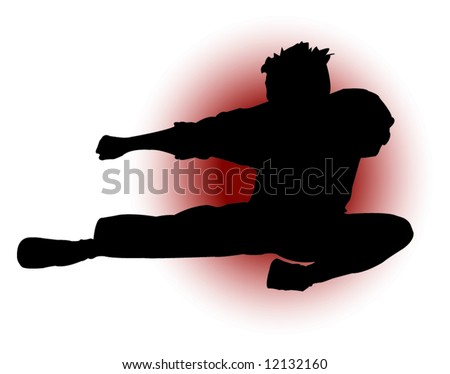Silhouette of a man throwing a flying kick