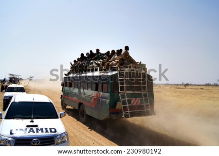 MUKJAR ,Southern Sudan - April  25, 2011 : Unidentified people on On the roof of the bus.THAI Military Peacekeeping mission in Southern Sudan.