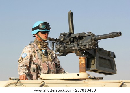 MUKJAR ,SOUTHERN SUDAN - SEPT 16, 2011 : Unidentified thai soldier .THAI Military Peacekeeping mission in Southern Sudan ,The vehicle infantry
