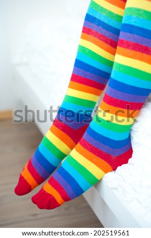 Legs in striped socks stockings.