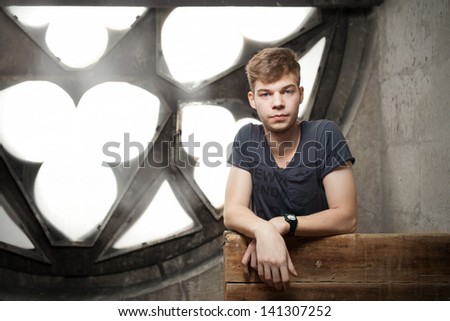 young man looking at camera in a gothic church