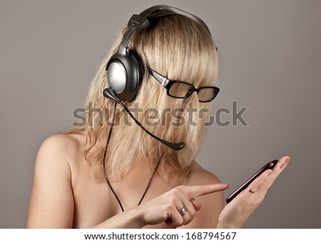 The girl with the phone in glasses and headphones represents a primitive man
