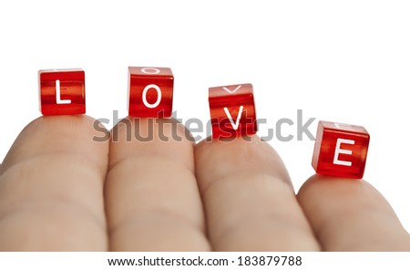 The word love of cubes on my fingertips
